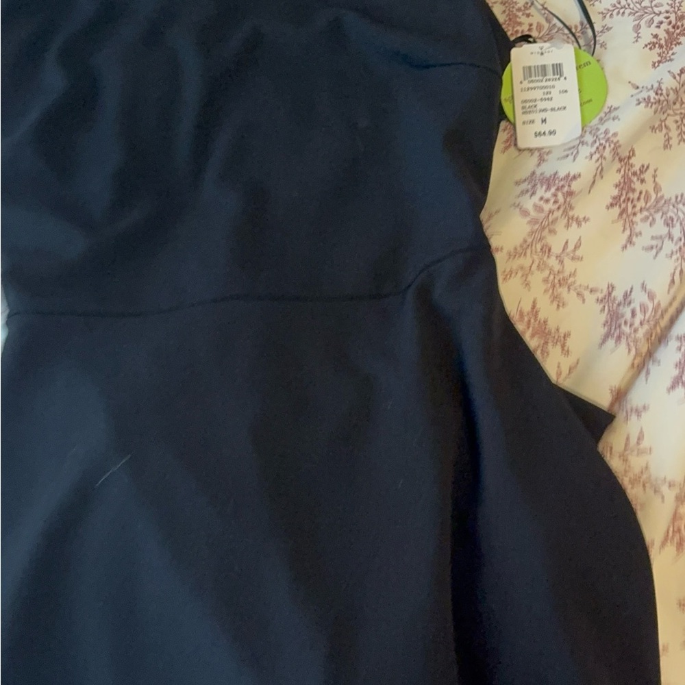 Elegant Black Dress with Open Back Ruffle Detail